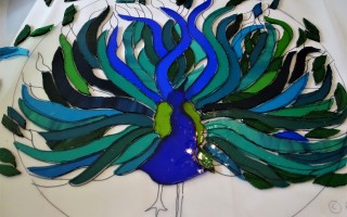 Peacock cutting glass pieces to the cartoon