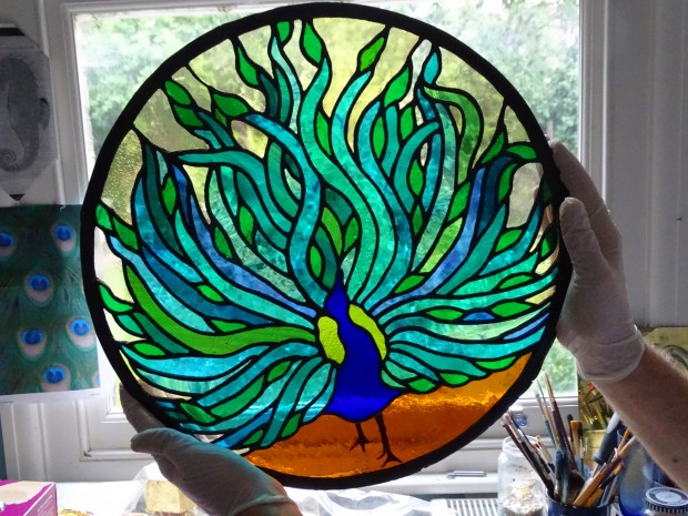 Peacock stained glass ready for cleaning and framing